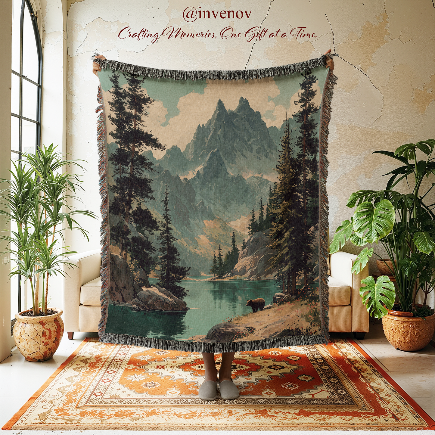 Woven blanket with mountain and forest design in a room with plants and furniture.