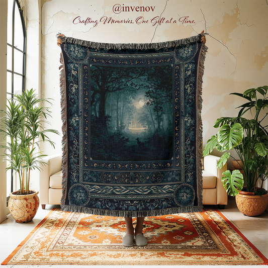 A large woven tapestry with a dark forest scene and fringe edges is held up in a room. The tapestry features a moody night forest with a glowing moonlit lake, surrounded by a detailed border.