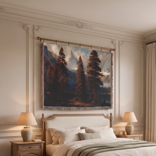 A large woven wall tapestry featuring a classical landscape painting of pine trees and mountains, hanging on a gold rod above a bed in a classic cream-colored bedroom.