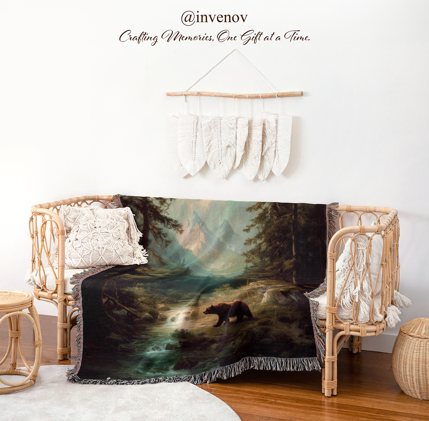 Blanket with bear design draped over a chair in a room with wicker furniture and white walls.