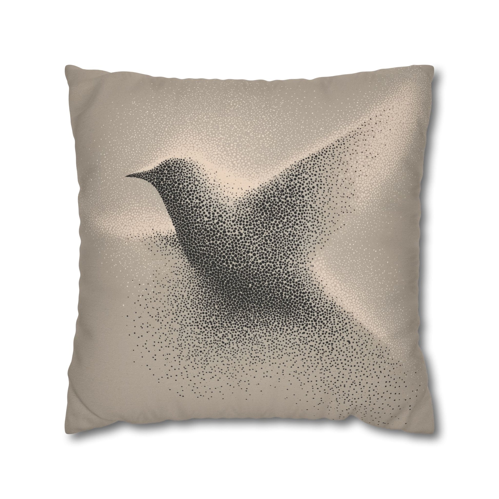 A square throw pillow in a warm beige color, featuring a printed design of a flying bird composed of black dots, shown against a plain white background.