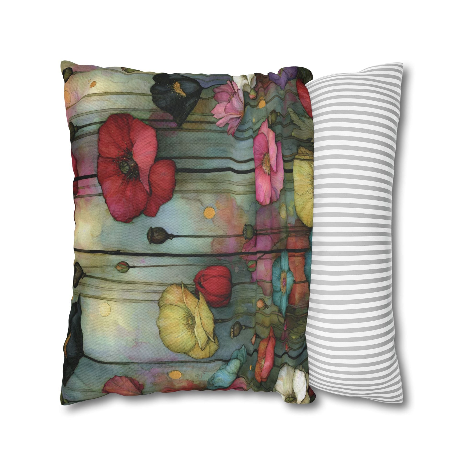 Floral-patterned pillow next to a striped pillow on a white background