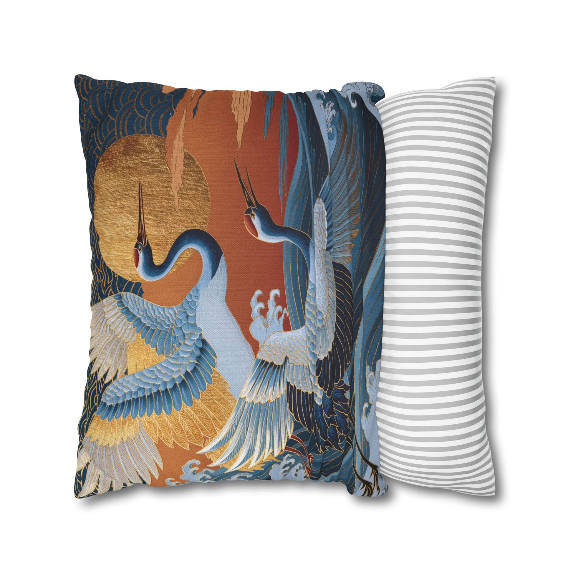 A decorative throw pillows shown on a white background. The pillow features a Japanese-style print with two blue cranes, a large gold sun, and dark blue wave patterns.