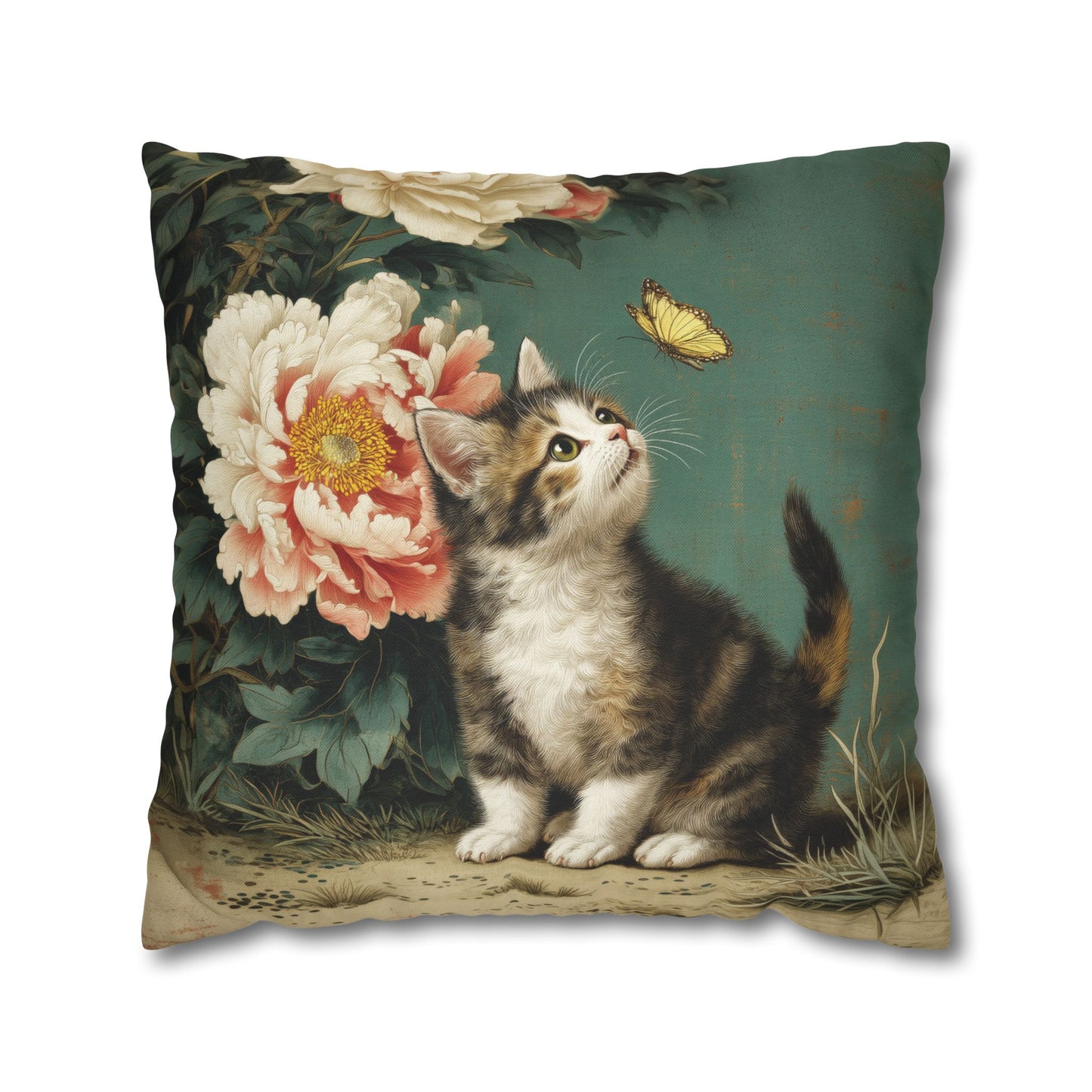Decorative pillow with a kitten and floral design on a green background