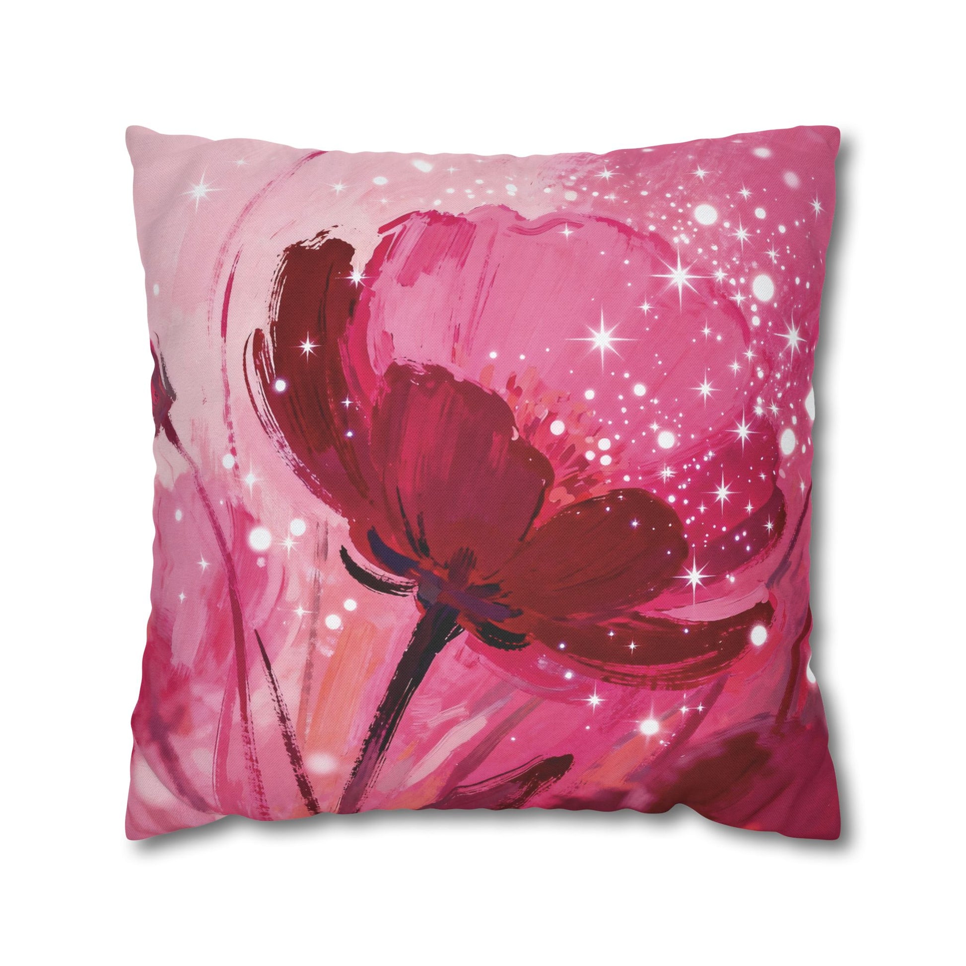 Decorative pillow with a red flower design on a pink background