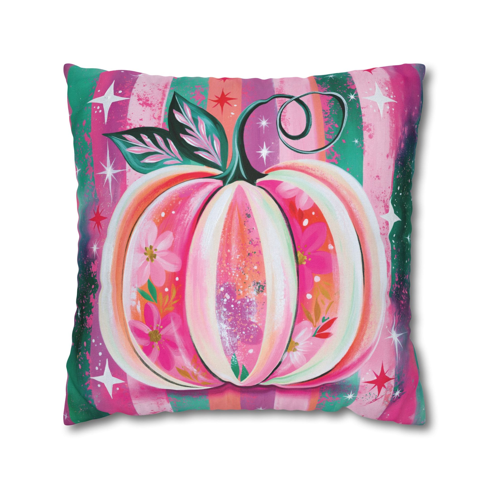 A square decorative throw pillow featuring a colorful painted pumpkin design with pink, orange, green, and white tones on a white background.