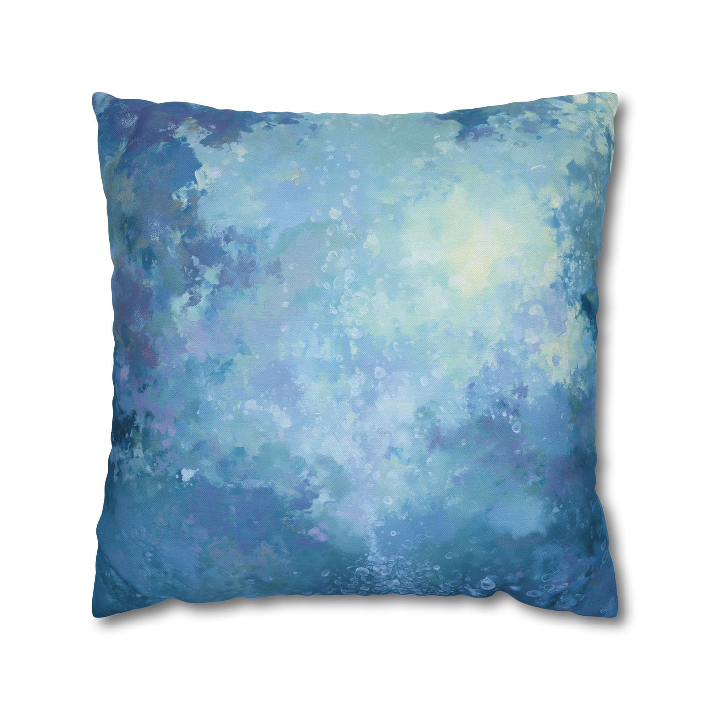 A square throw pillow featuring an abstract watercolor-style print in shades of blue, teal, and soft lavender, shown against a plain white background.