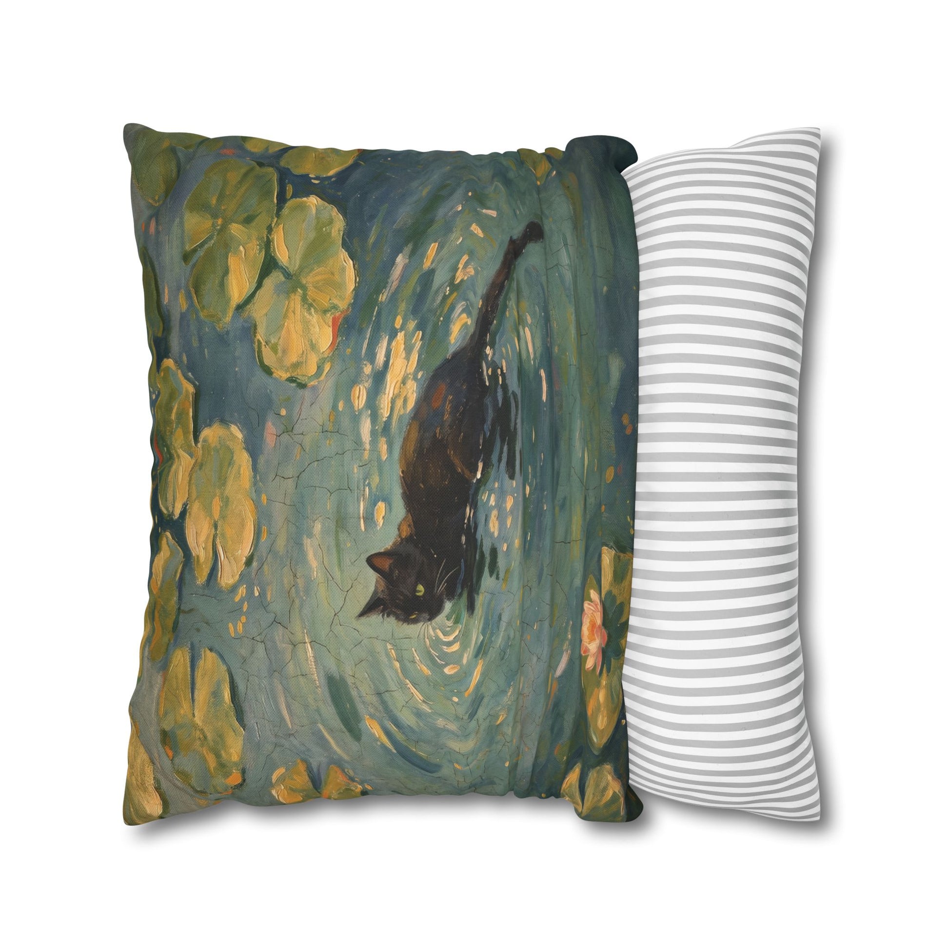 Decorative pillow with a black cat design next to a striped pillow on a white background