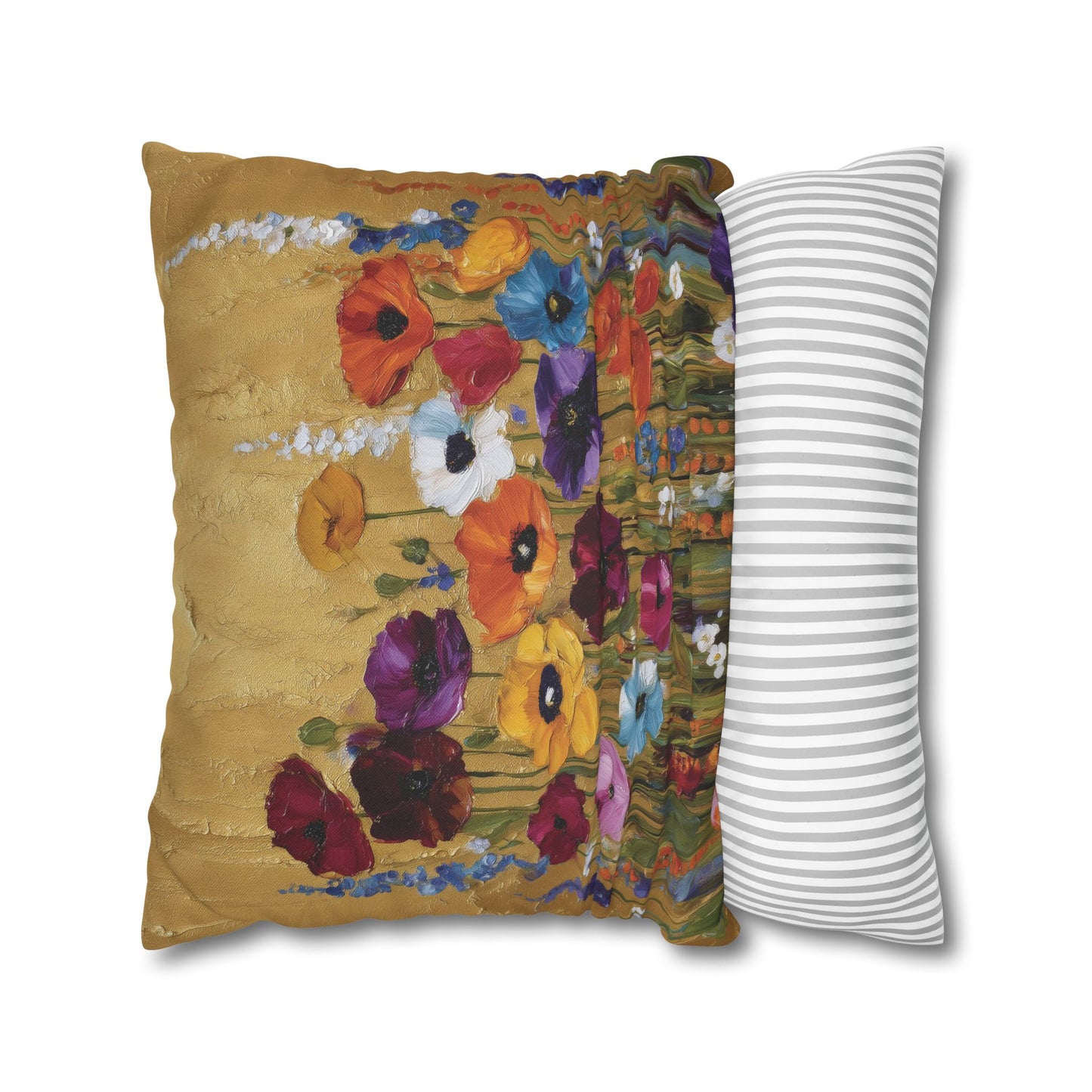 Decorative pillow with floral design next to a striped pillow on a white background