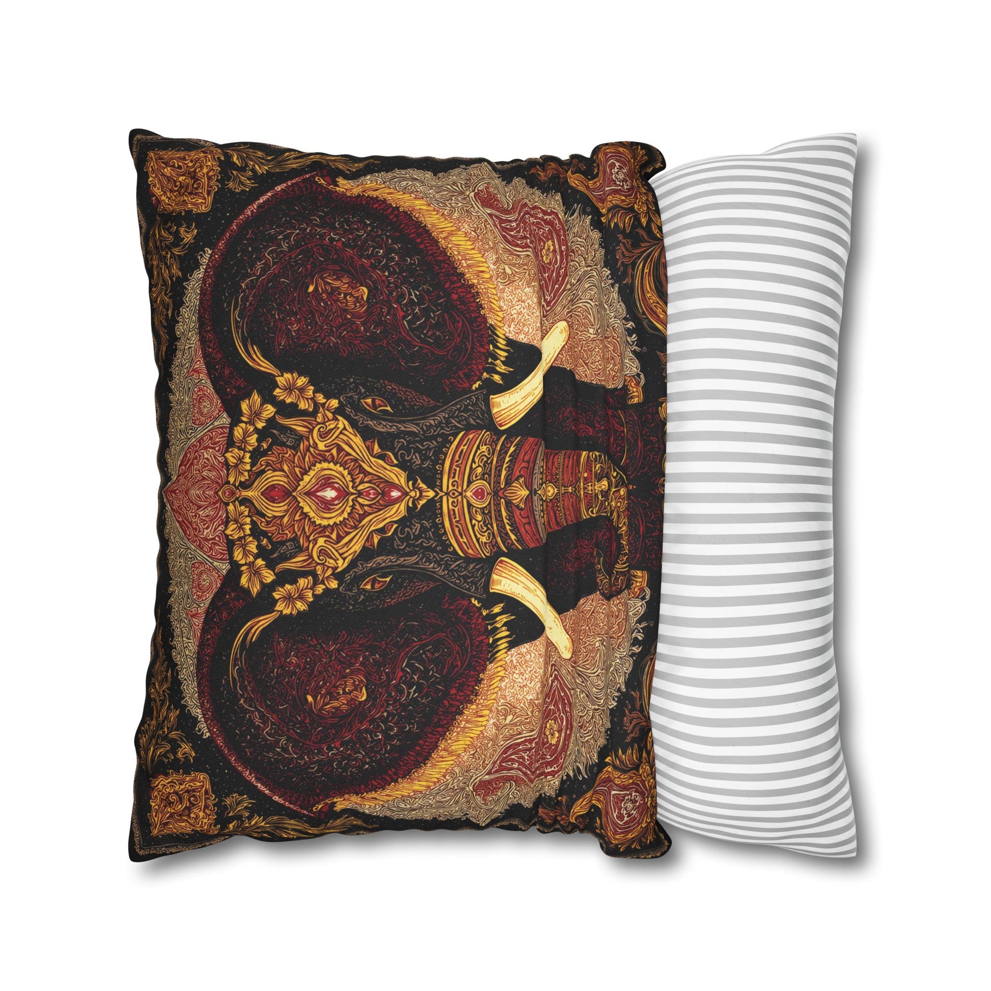 Decorative pillow with intricate design next to a plain striped pillow on a white background