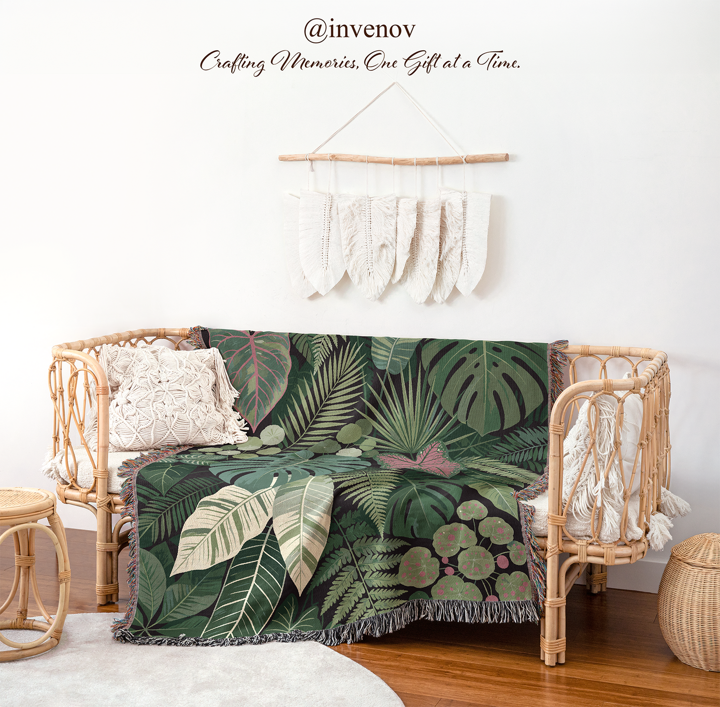 Tropical leaf patterned blanket draped over a wicker chair