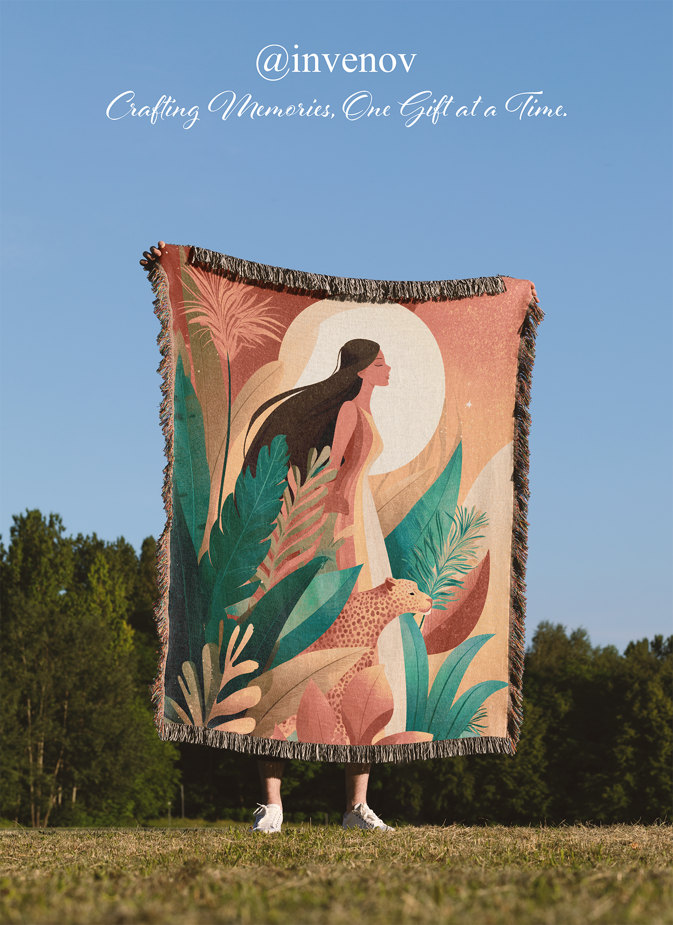 Person standing outdoors with a decorative blanket featuring an artistic design of a woman and plants.