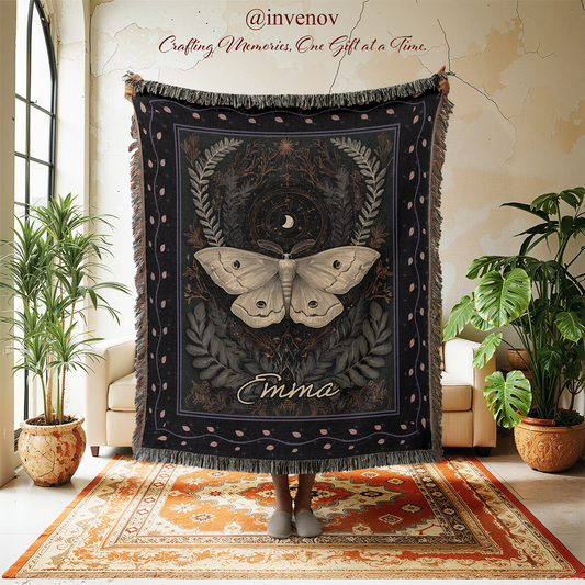 Decorative blanket with moth design in a room with plants and furniture.