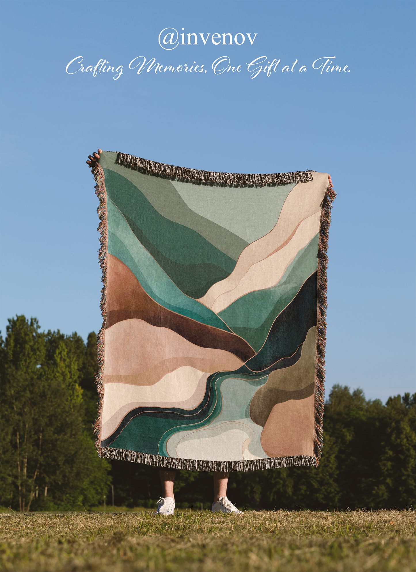 Person standing under a colorful patterned blanket in a field 