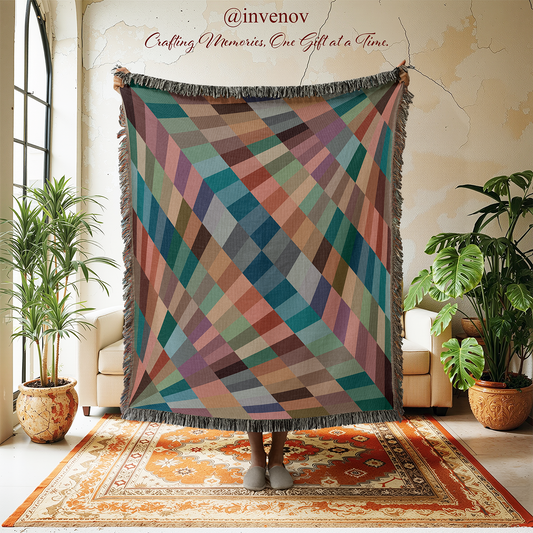 Colorful diamond patterned throw blanket displayed in a room with plants and furniture.