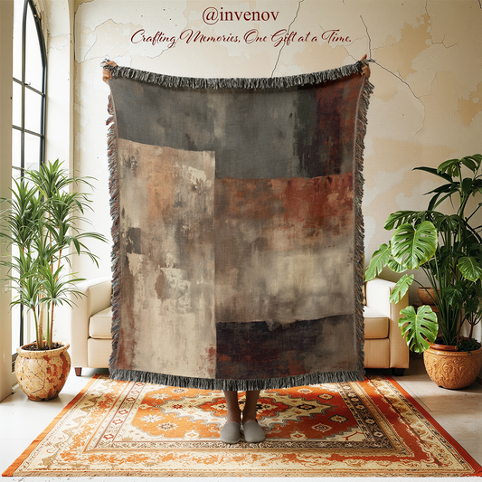 Woven blanket with abstract pattern in a room with plants and a rug.