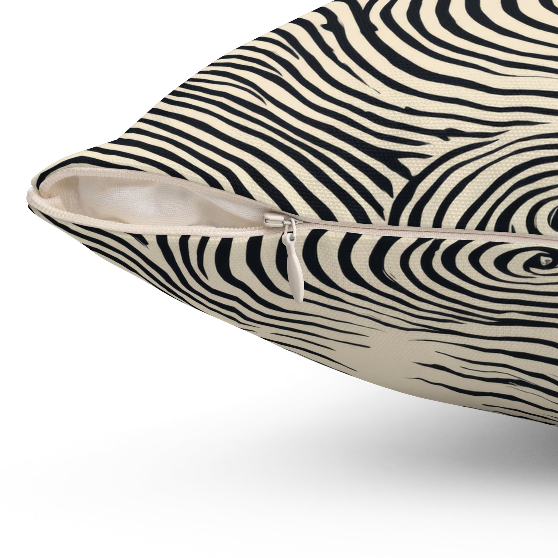 Close-up of a square throw pillow with a blue and cream zebra stripe pattern, showing a zippered side opening.