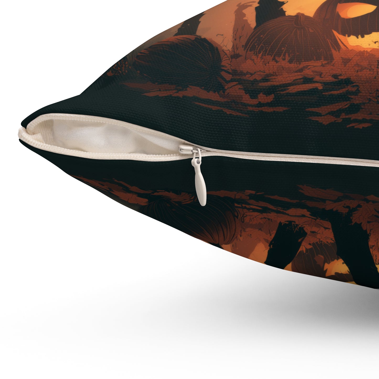 Close-up of a decorative throw pillow with a dark patterned cover featuring orange and brown abstract landscape-like shapes, shown with a partially unzipped white zipper and white inner lining on a light gray background.