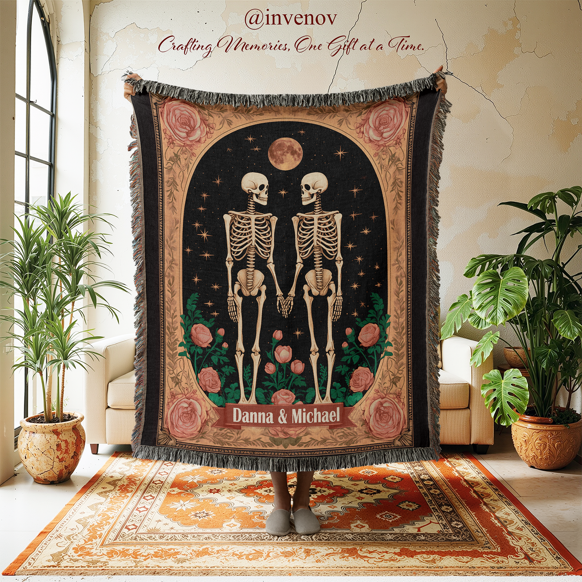 Decorative tapestry with skeletons and roses on a stand in a room with plants and furniture.