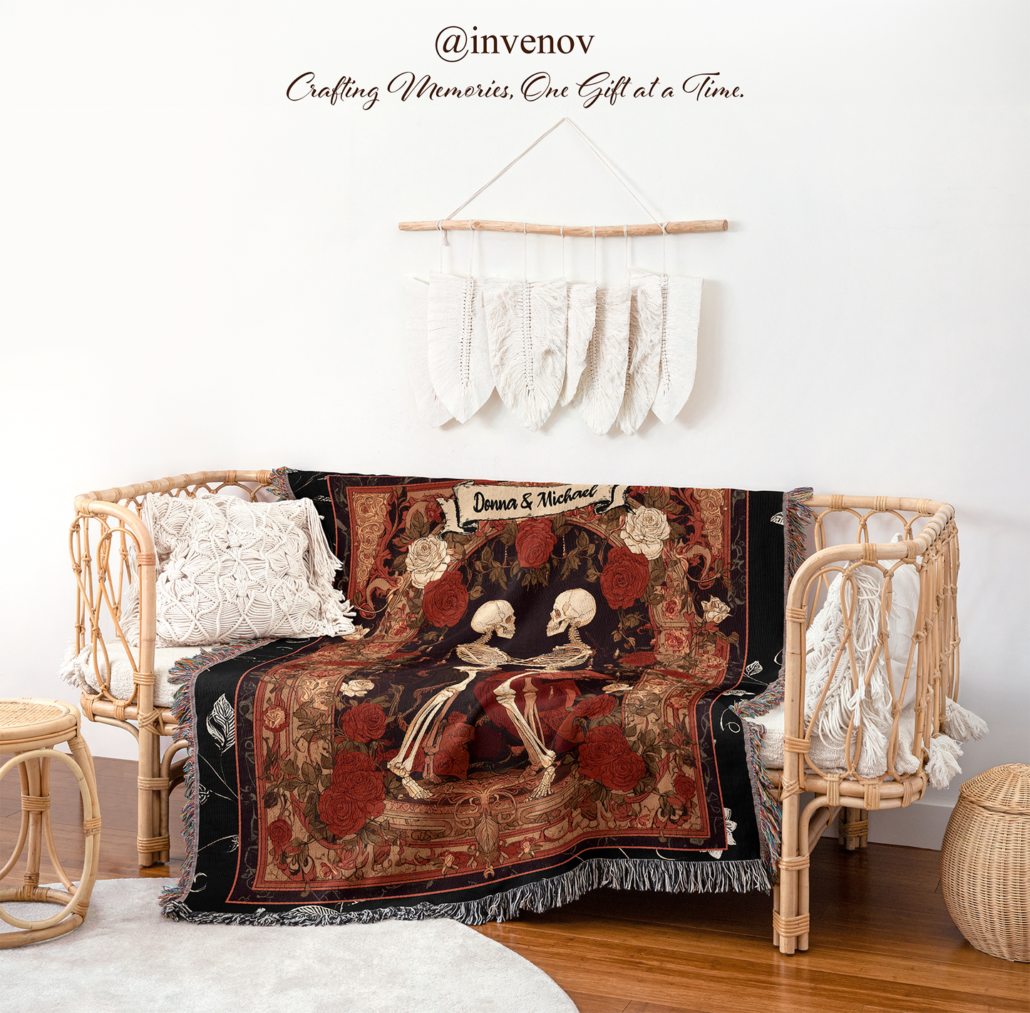 Decorative blanket with skeleton design draped over a chair in a room with wicker furniture and white walls.