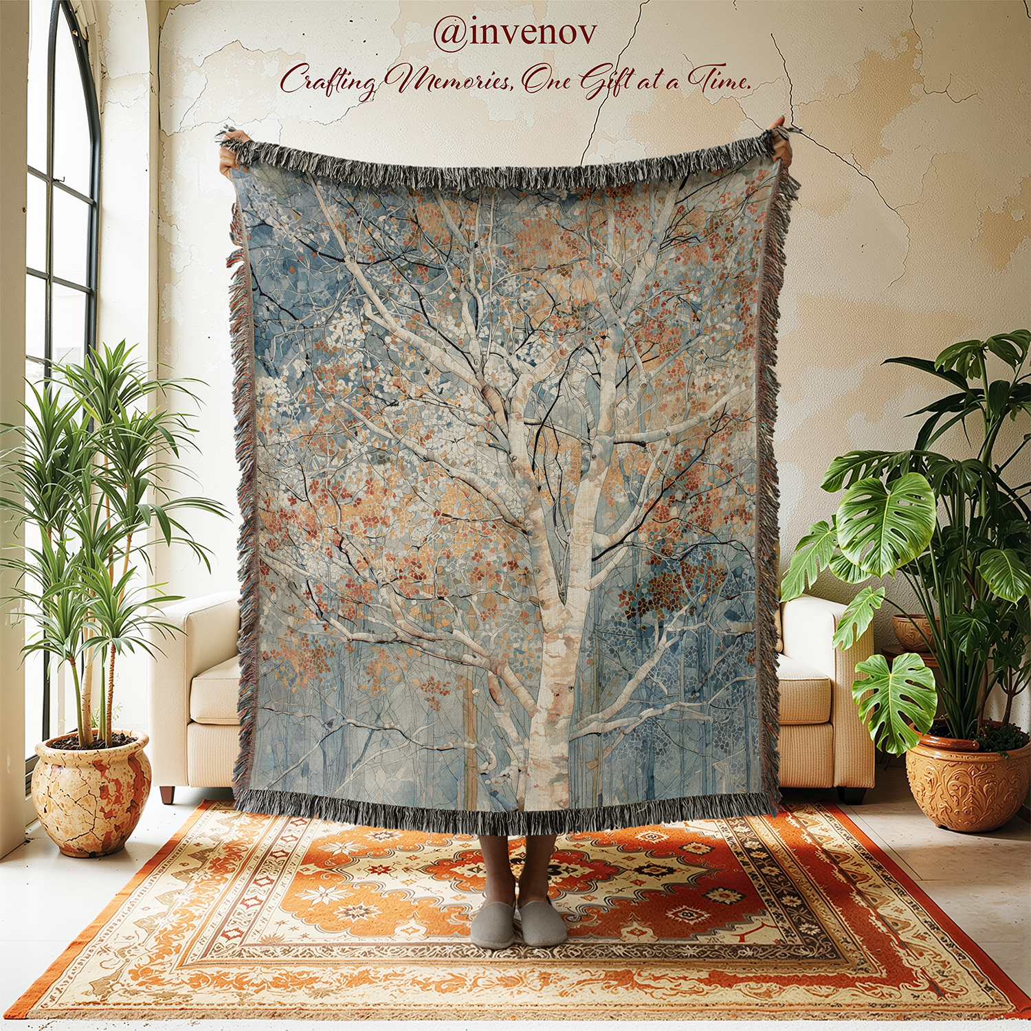 Decorative tapestry with tree design in a room with plants and furniture.