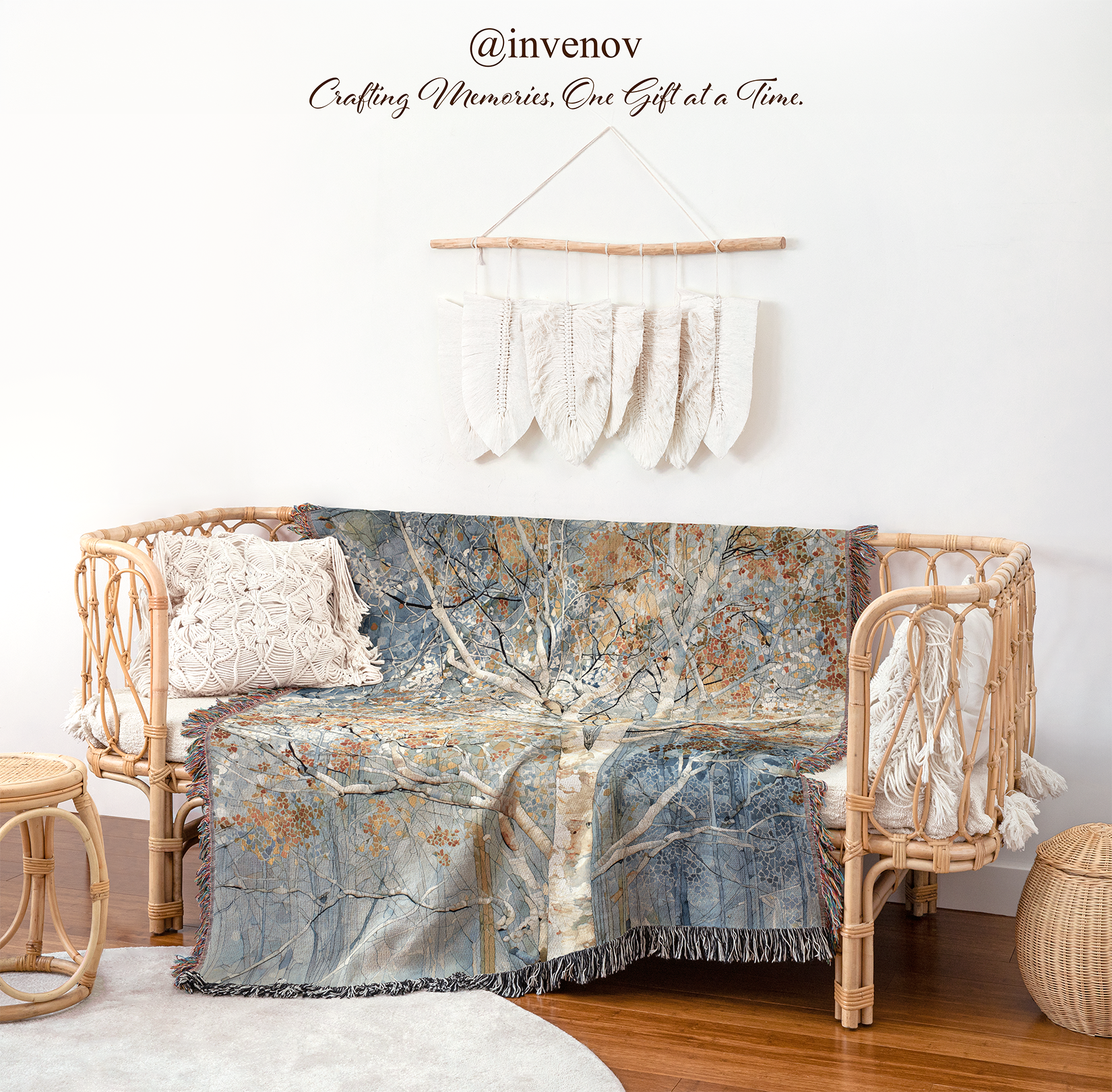 Decorative blanket with tree pattern draped over a wicker chair