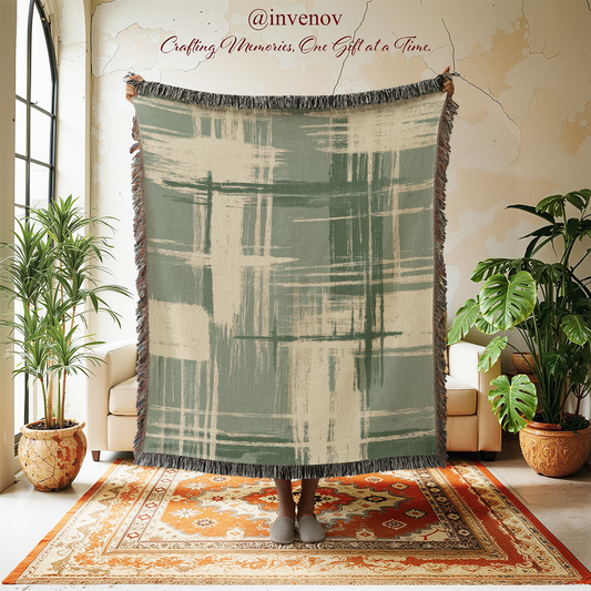 Decorative throw blanket with abstract pattern in a room with plants and furniture.