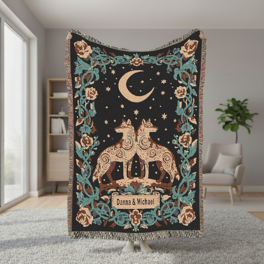 Decorative throw blanket with wolfs and moon design in a room setting