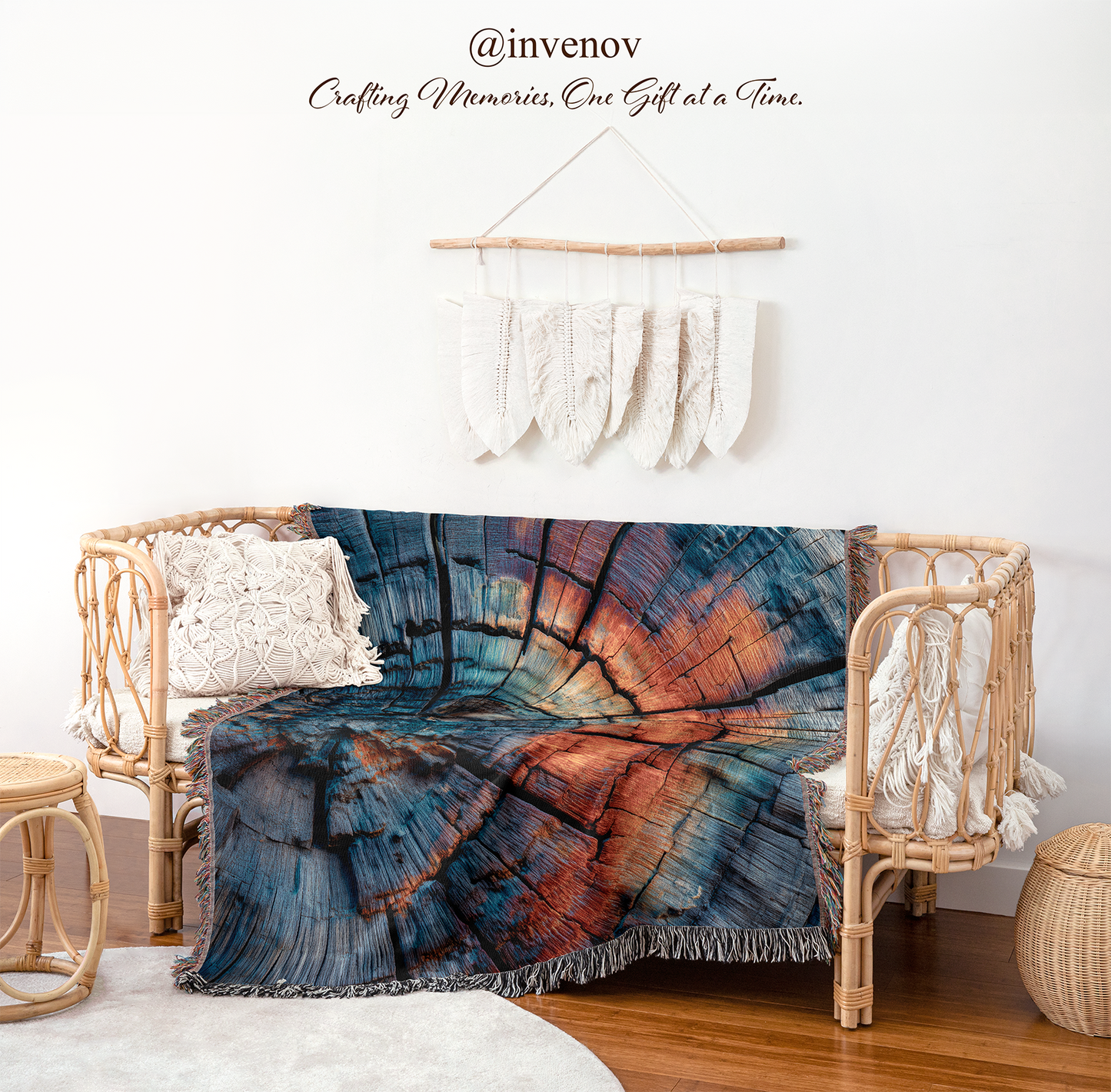 Colorful blanket draped over a wicker chair with a white wall and decorative elements in the background.